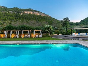 A swimming pool with a view of a mountainous landscape. - Historic Finca in Mallorca with Pool for 12 Guests (Andratx)
