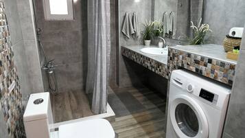 Combined shower/tub, hair dryer, towels, soap