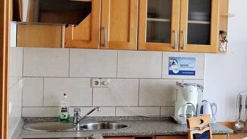 Fridge, toaster, cookware/dishes/utensils