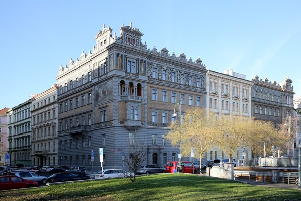 A large, historic building with classical architecture, multiple floors, and a prominent entrance.