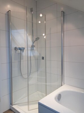 Bathtub, hair dryer, towels, soap