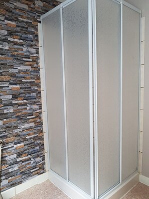 Shower, free toiletries, hair dryer, towels