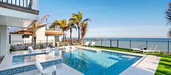 Luxury beachfront home with private pool, putting green, golf cart and bikes!
