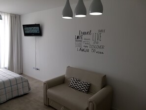 Standard Apartment, 1 Queen Bed with Sofa bed, Non Smoking, City View | Living area | Flat-screen TV - Independencia 1302 9C by HB (Buenos Aires)