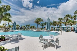 Relax by the resort style pool surrounded by tropical paradise.