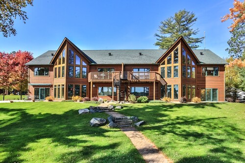 Modern Northwoods Condo on the Eagle River Chain of Lakes with a private dock!
