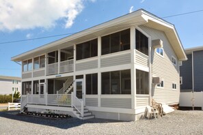 Screen porch on each unit provides a great spot to enjoy the sea breeze! - Steps to the Beach 2BR Condo Parking Porch (Dewey Beach)