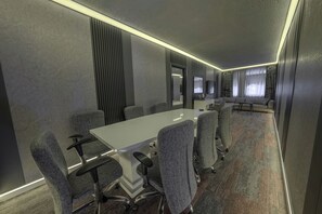 A conference room with a long table, grey upholstered chairs, and a carpeted floor. - Tryp By Wyndham Istanbul Sancaktepe (Istanbul)
