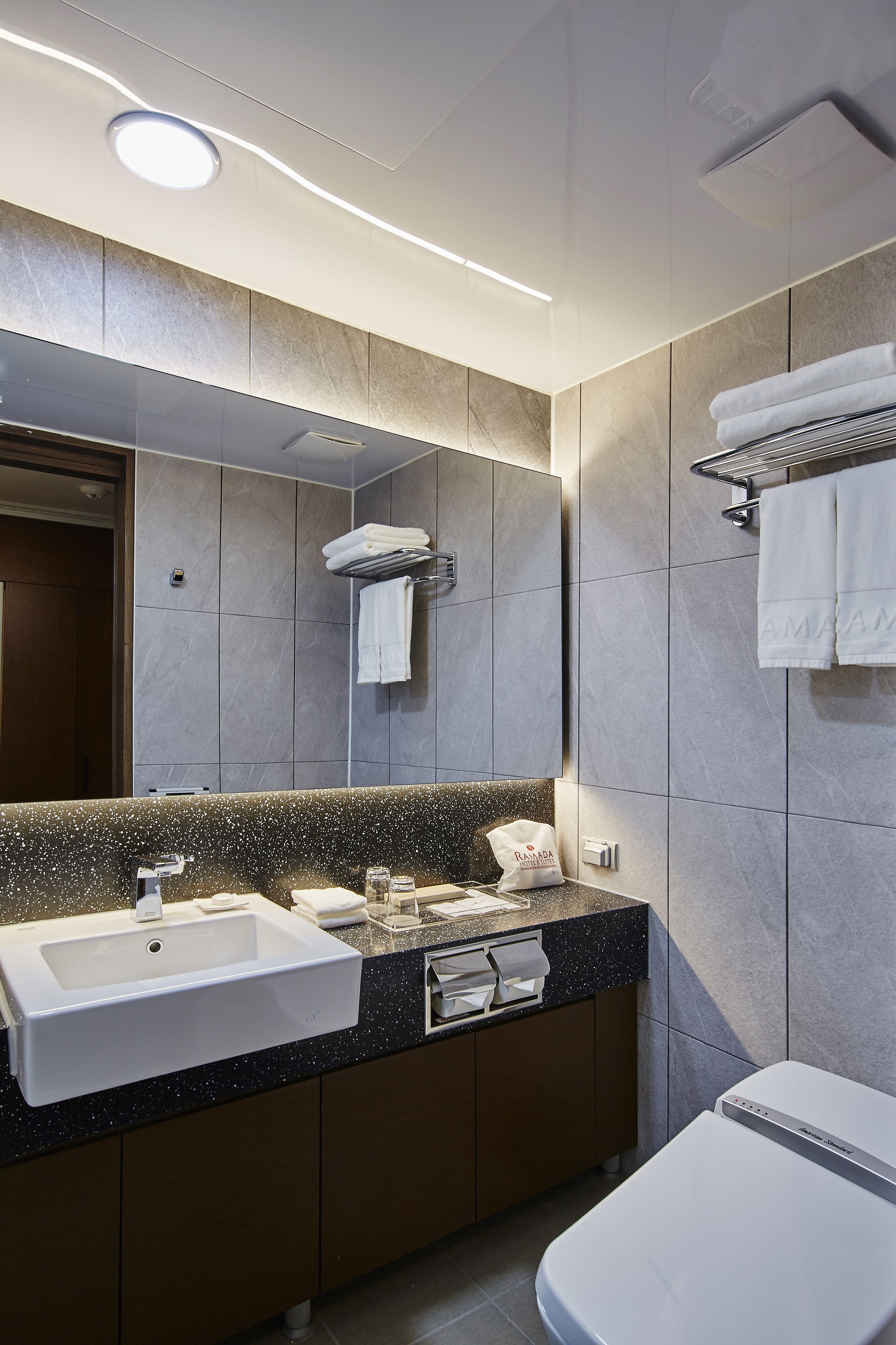 hair dryer, bathrobes, slippers, bidet