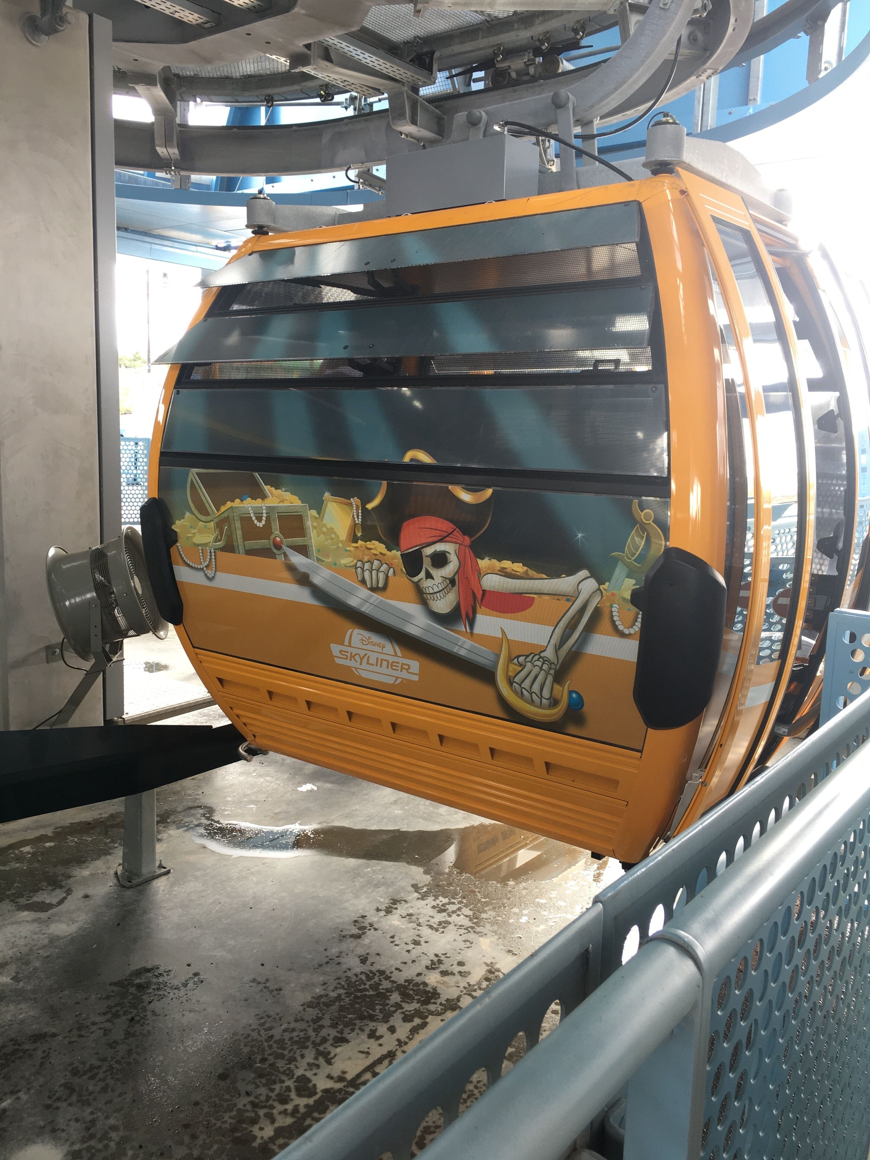 A vehicle with a Disney Skyliner logo and a pirate-themed design.