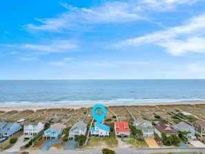 A coastal residential area with houses, a beach, and a clear sky. - "Holden You" - Oceanfront Home w/ Pool, 5 Bedrooms / 3 Bathrooms (Holden Beach)
