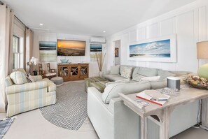 Flat-screen TV, fireplace, books