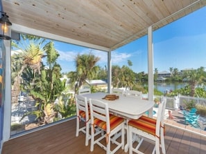 Outdoor dining - Fish Tales & Flip Flops - Spectacular Palm Island pool home (Placida)