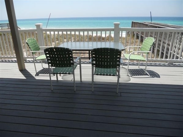 Enjoy ocean views from this deck with comfortable seating for two.