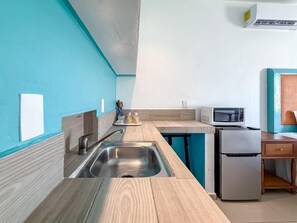 Fridge, coffee/tea maker, cookware/dishes/utensils