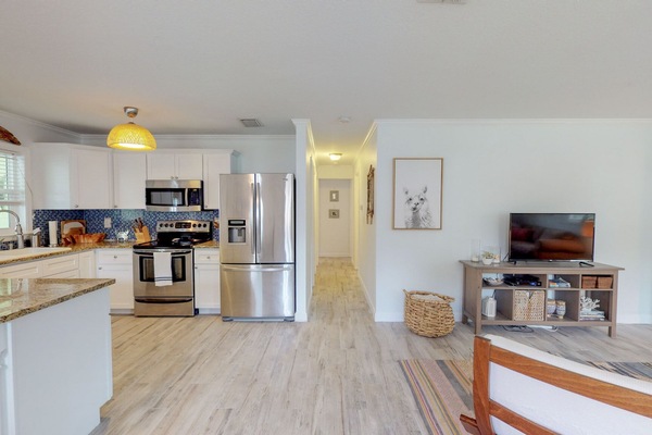 Open concept living, kitchen, and dining room for easy beach living!