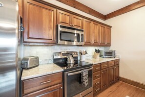 Dishwasher, coffee/tea maker, cookware/dishes/utensils