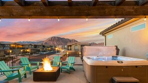 A rooftop patio with a fire feature, outdoor seating, and a hot tub. - Paintbrush Retreat: Private Pool and Hot Tub, Movie Theater + Paradise Village W (Santa Clara)
