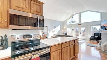 Dishwasher, coffee/tea maker, cookware/dishes/utensils, dining tables