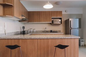 Apartment, 2 Bedrooms | Private kitchen | Full-size fridge, microwave, stovetop, coffee/tea maker