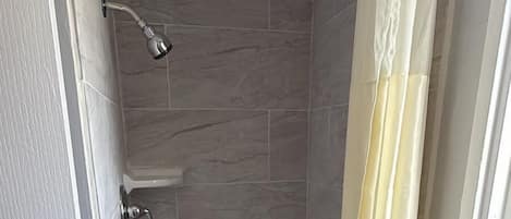 Basic Single Room, 1 Queen Bed, City View | Bathroom | Combined shower/bathtub, towels, soap, toilet paper