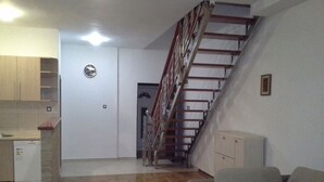 Dúplex, vista al mar | Sala de estar | Televisión de pantalla plana 