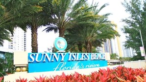 A sign for Sunny Isles Beach with a palm tree logo and the text "Florida's Riviera". - Beautiful/Spacious Ocean Reserve Sunny Isles Beach #STR-02481 (Sunny Isles Beach)