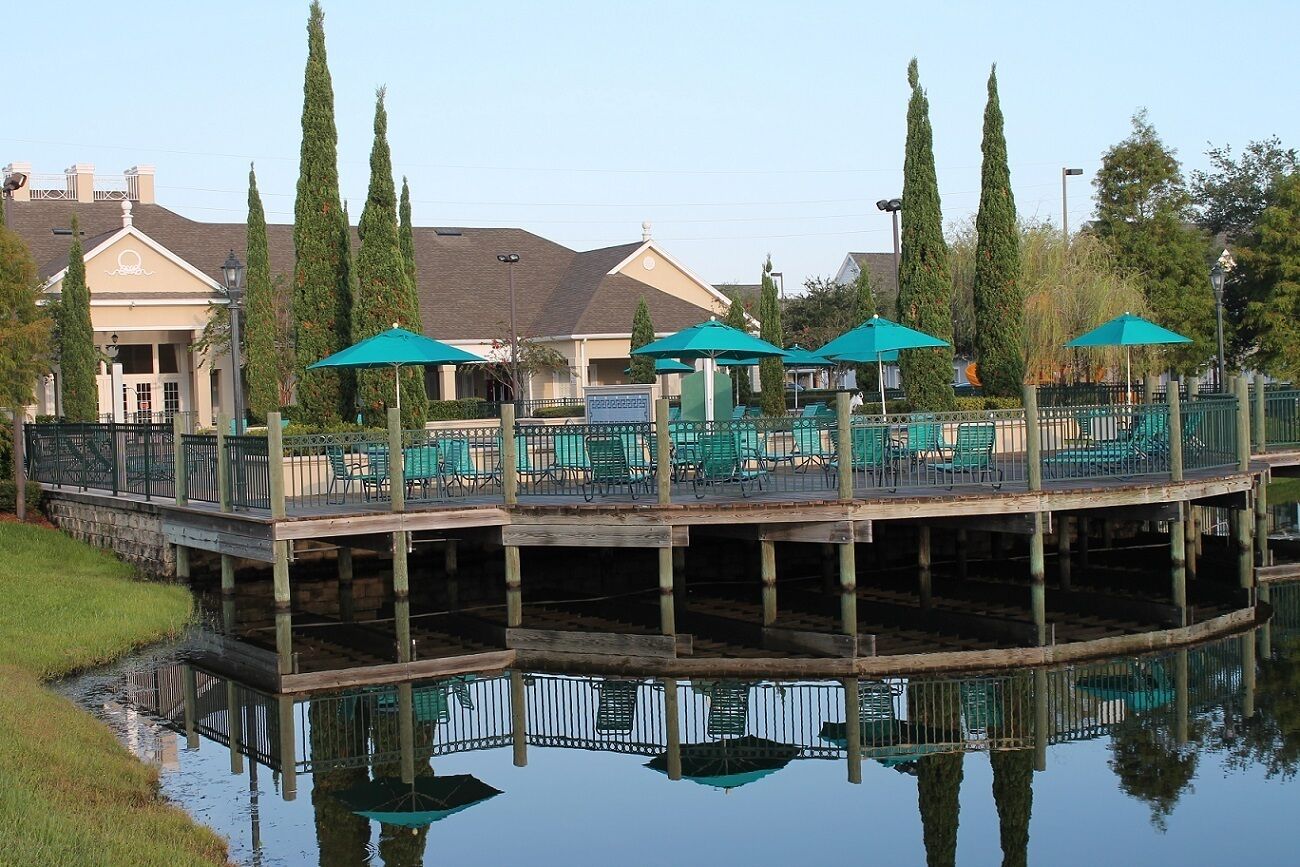 the cluhouse deck overlooks a lake.  
