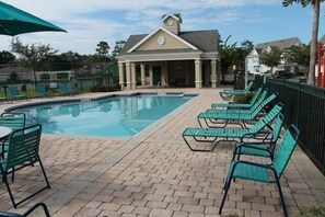 A swimming pool with lounge chairs and a covered pavilion. - Venetian Bay Townhouse with Room for Ten - VB006 (Kissimmee)