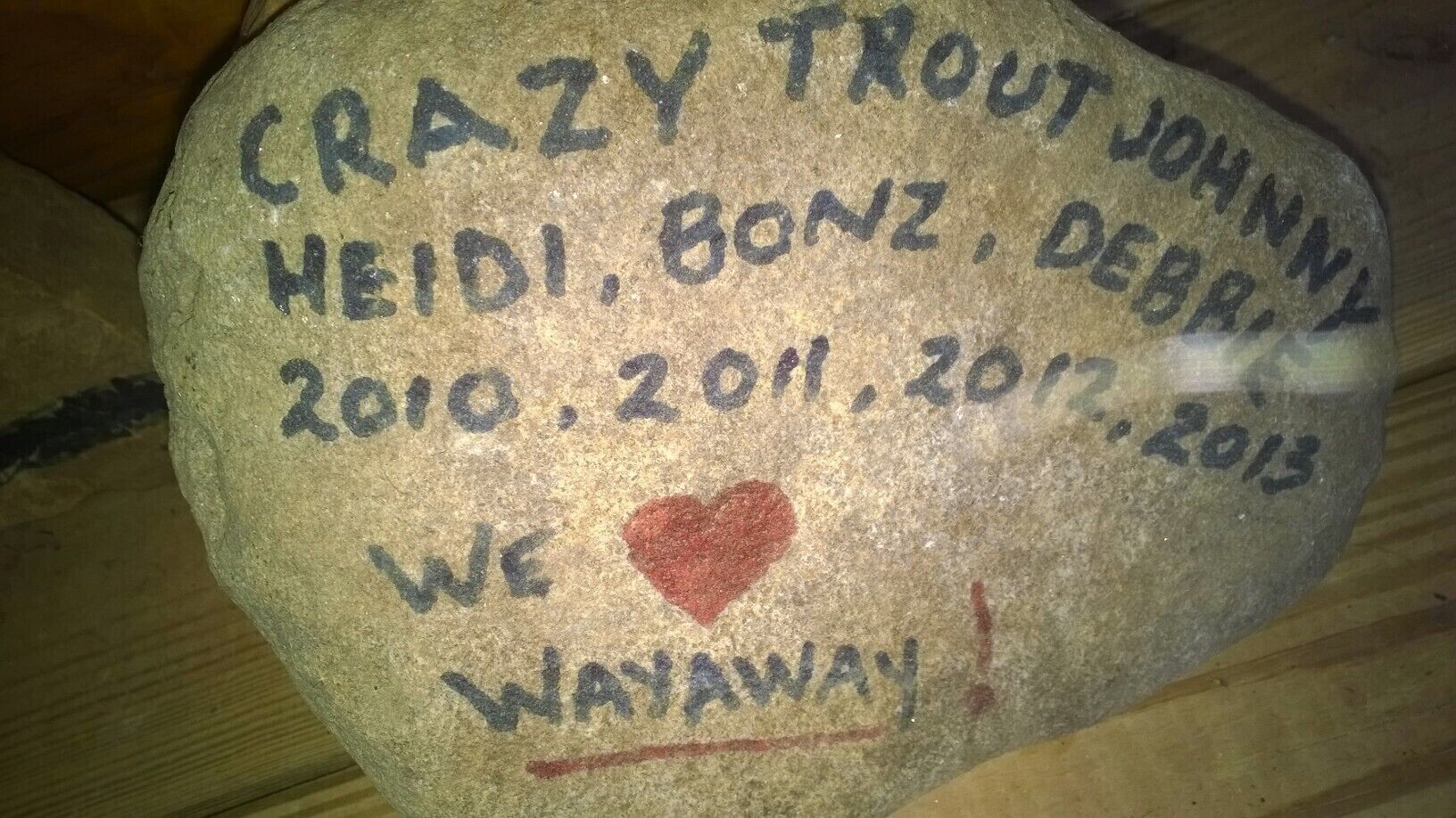 A stone with names and dates, a heart symbol, and the phrase "We Wayaway!"