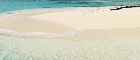 On the beach, sun loungers, beach towels