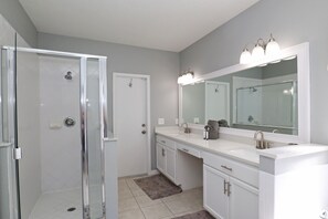 Combined shower/tub, hair dryer, towels, soap