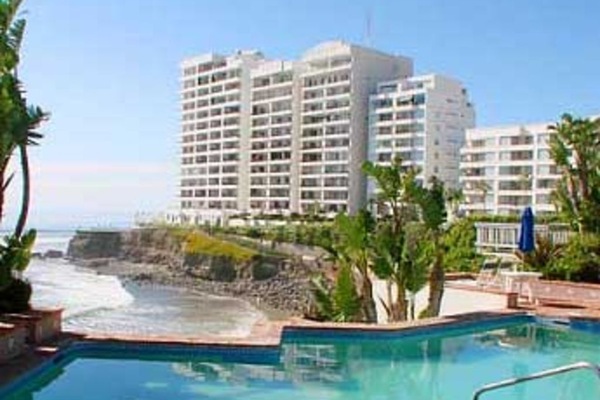 Condo complex. Unit is second building from left above palm trees
