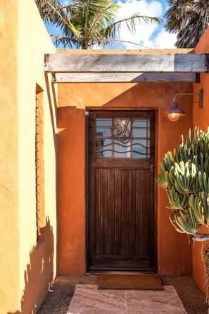 Enter a warm and inviting home through this beautifully painted entrance.