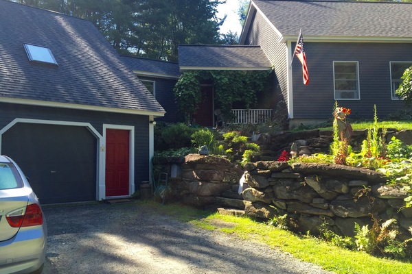 Outdoors always nicely maintained. Apt is above garage on left side.