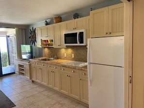 Fridge, microwave, stovetop, coffee/tea maker