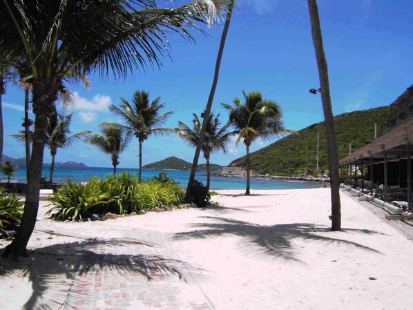 On the beach, sun-loungers, beach towels