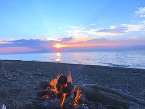 On the beach, sun-loungers