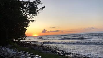 On the beach, sun-loungers