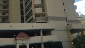 A multi-story hotel with a prominent sign reading "The Verandas by the Sea". - Family-Friendly Oceanfront Condo That Has A Pool, Lazy River, And Jacuzzi. (North Myrtle Beach)