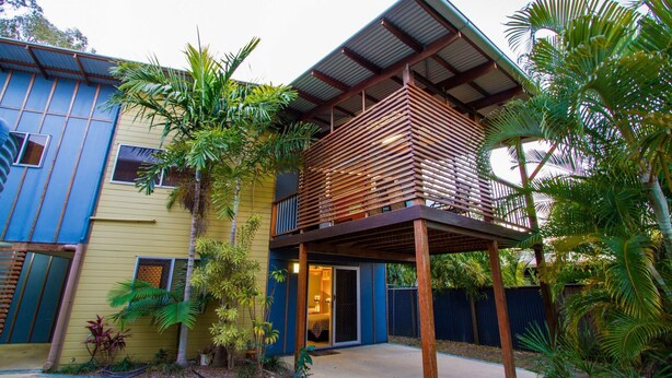 A two-story building with a balcony and a covered outdoor area. - DAMIA VILLA 2 AGNES WATER (AGNES WATER)