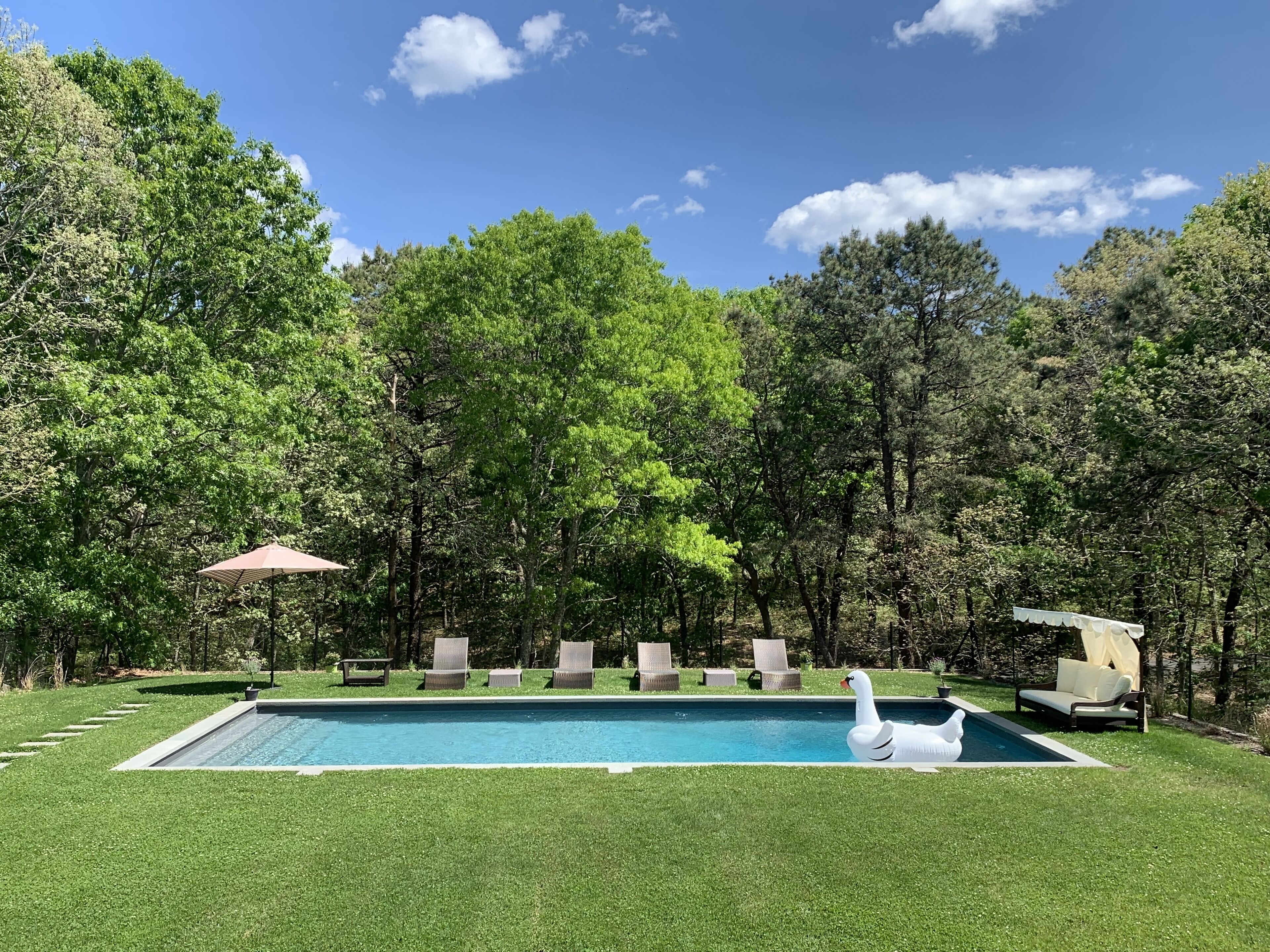 Outdoor living...Ideal location in East Hampton with resort inspired backyard!!