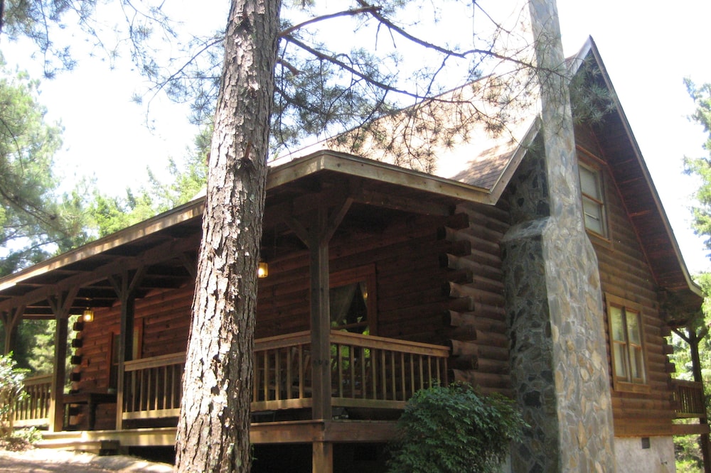 Cabin with a fire place in the woods