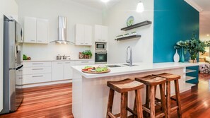 Fridge, microwave, oven, stovetop - DUNES  Agnes Water Four bedroom two level property with pool & free WIFI. Pet friendly. (Agnes Water)