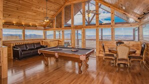 A wooden interior with a pool table, leather sofa, and dining set. - 🏔️ A Starr Peak View🌲 Resort Pool, Hot Tub & Game Room (Sevierville)
