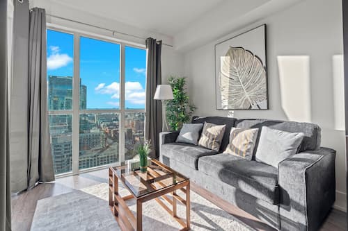 Exclusive Apartment, Multiple Beds, Kitchen, Partial Lake View | Living area | 42-inch Smart TV with cable channels, TV, Netflix