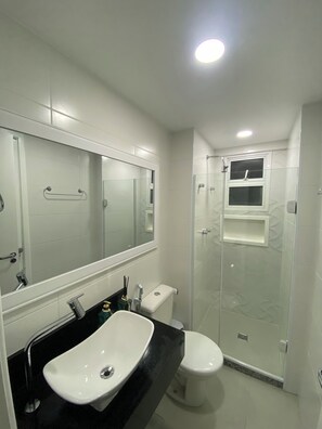 Shower, hair dryer, soap, toilet paper