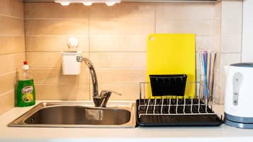Fridge, coffee/tea maker, electric kettle, cookware/dishes/utensils