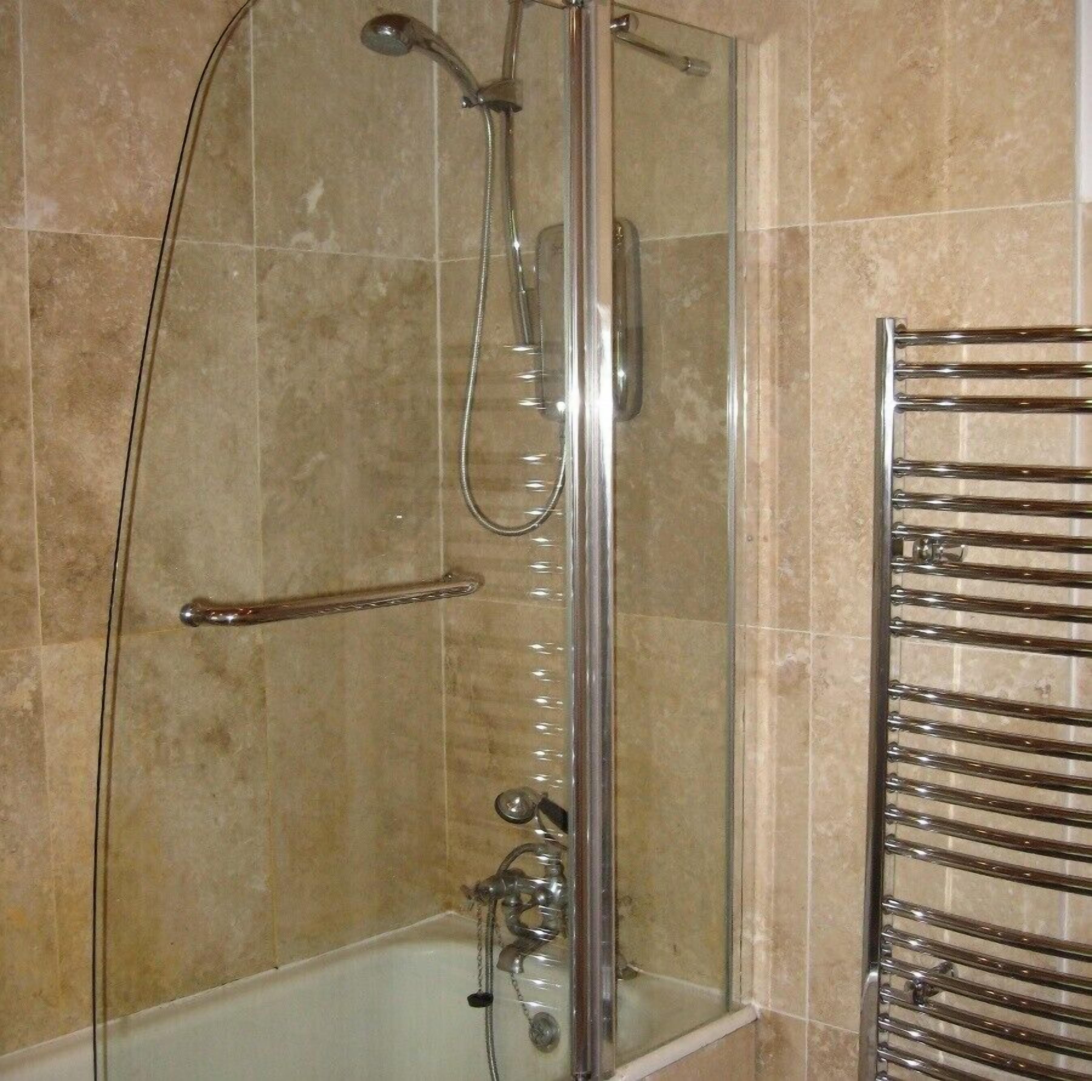 Combined shower/bathtub, hair dryer, towels, toilet paper
