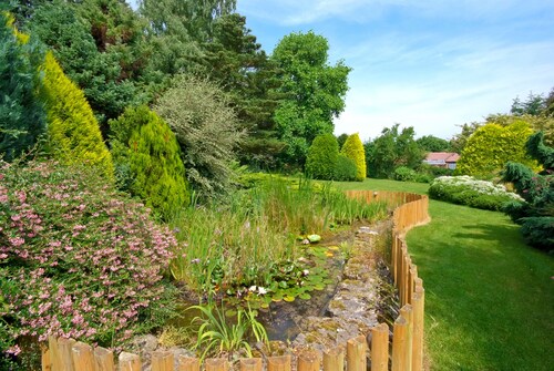 Manor house set in five acres of gardens with private golf course, near Ludlow.